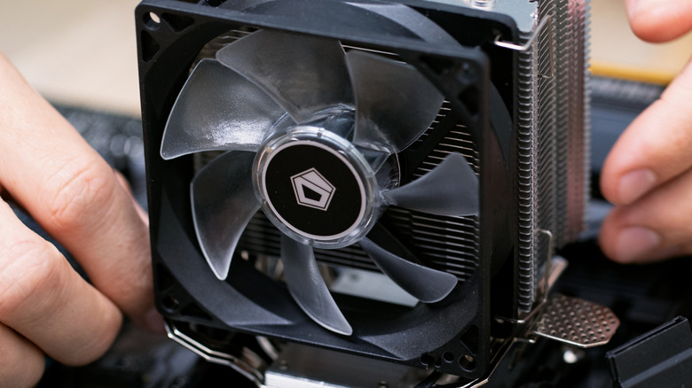 An air CPU cooler being fitted onto a motherboard