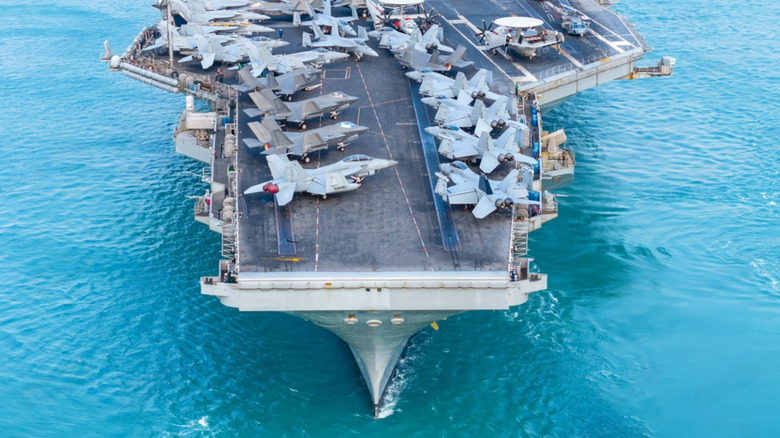 A close up view of the fore of the flight deck of an aircraft carrier