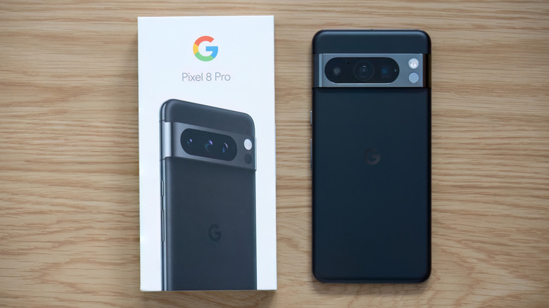 The Pixel 8 Pro next to its retail box.