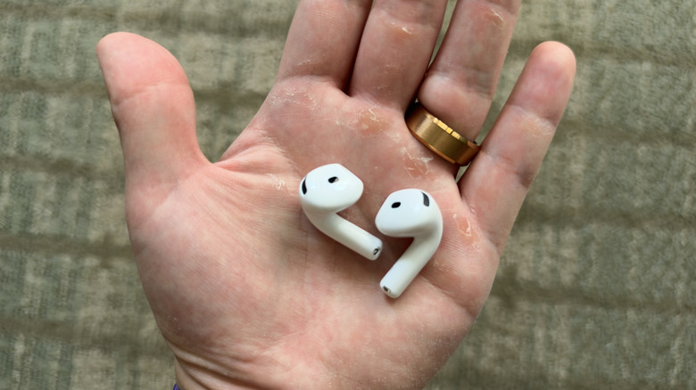 AirPods 5 buds sat in palm of my hand