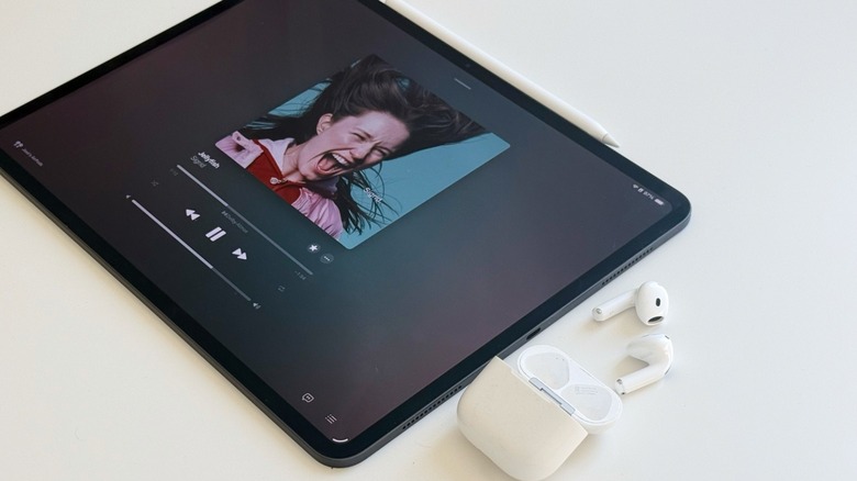 AirPods 4 alongside iPad Pro
