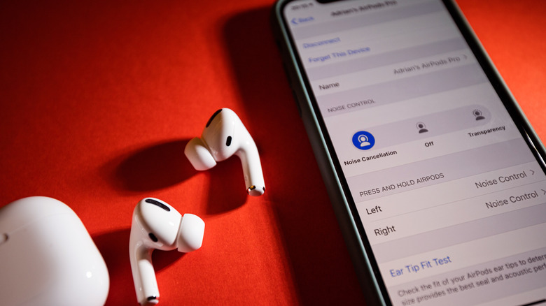 AirPods Pro next to an iPhone.