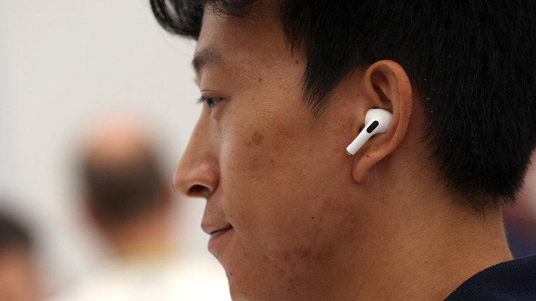 A person wearing AirPods Pro.