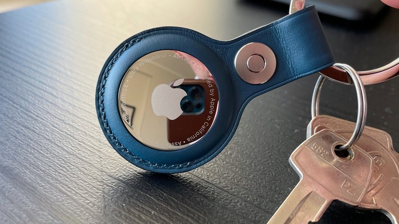 Close-up on Apple's AirTag with a keychain attached
