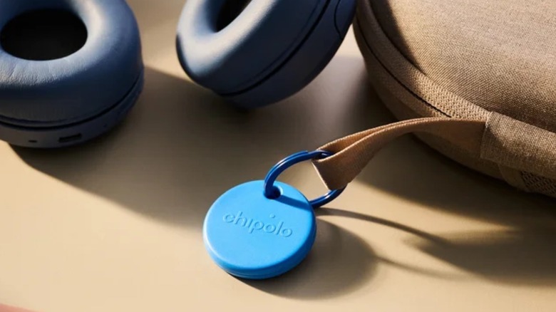 An item tracker attached to a headphone carry on case