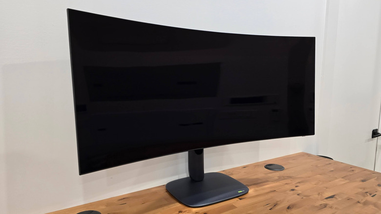 Side view of the Alienware AW39 5K OLED Monitor on a desk.