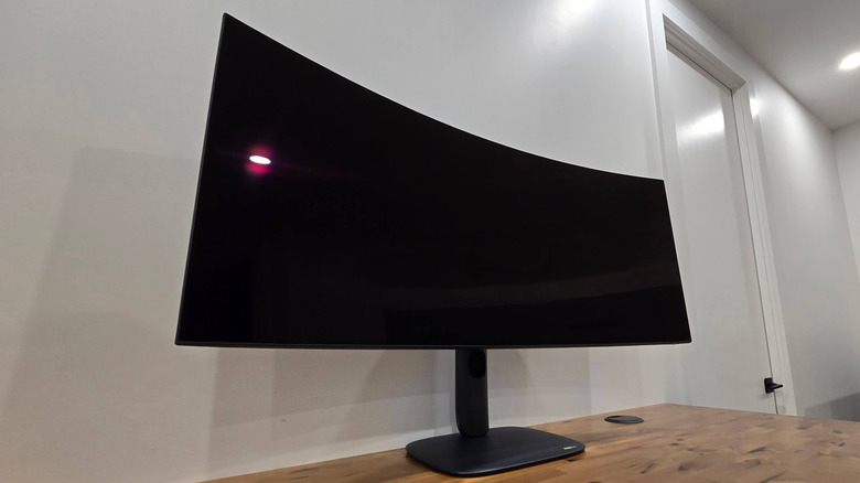 Low angle view of the Alienware AW39 5K OLED gaming monitor on a desk.