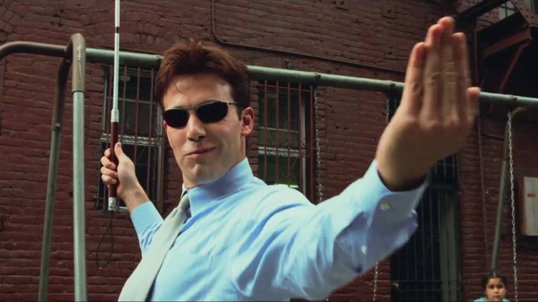 Matt Murdock with a cheeky smile during a fight