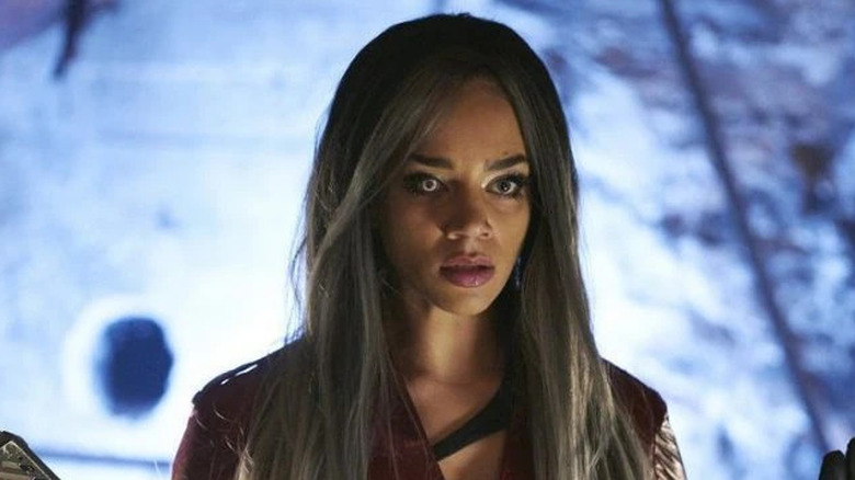 Dutch (Hannah John-Kamen) standing in a blue room on "Killjoys."
