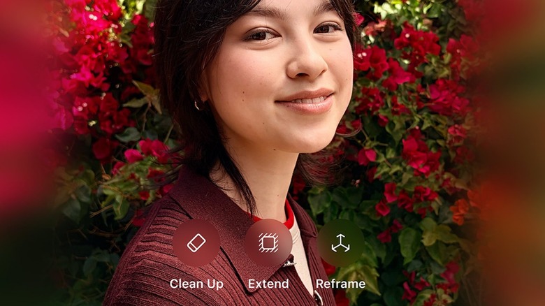 A photo of a woman with red flowers in the background