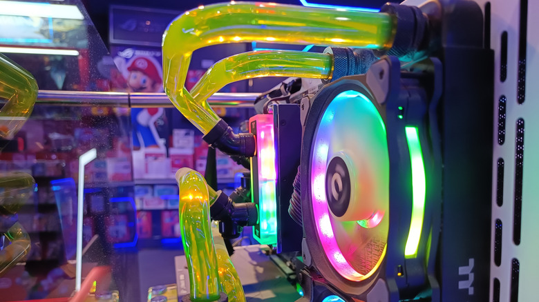 A custom cooling loop featuring green liquid and thermaltake hardware