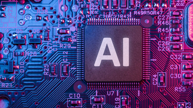 Closeup of a computer chip with the word AI written on it