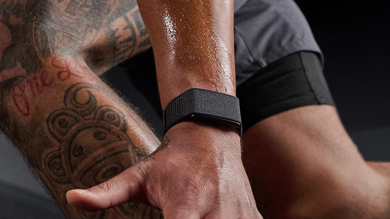 Close up of someone wearing an Amazfit Helio Strap while working out.