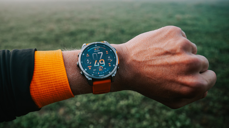 A Garmin Fenix 8 on a person's wrist.