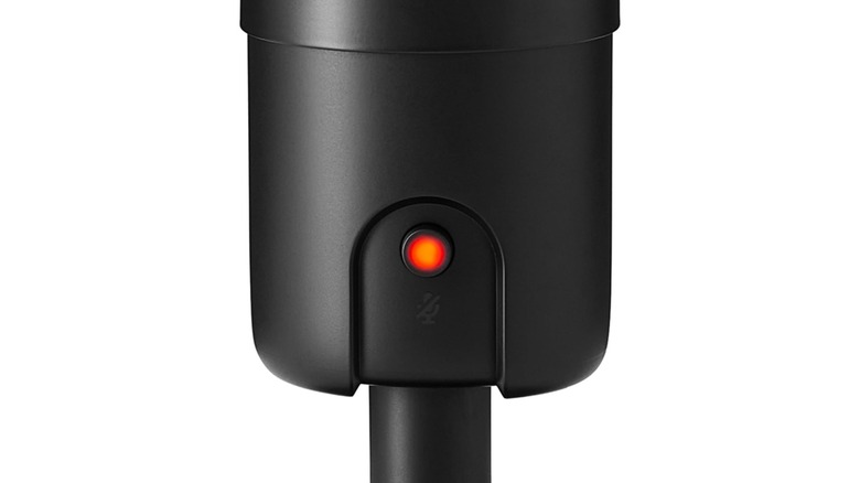 A zoomed-in shot of the Amazon Basics Condener Microphone's mute button