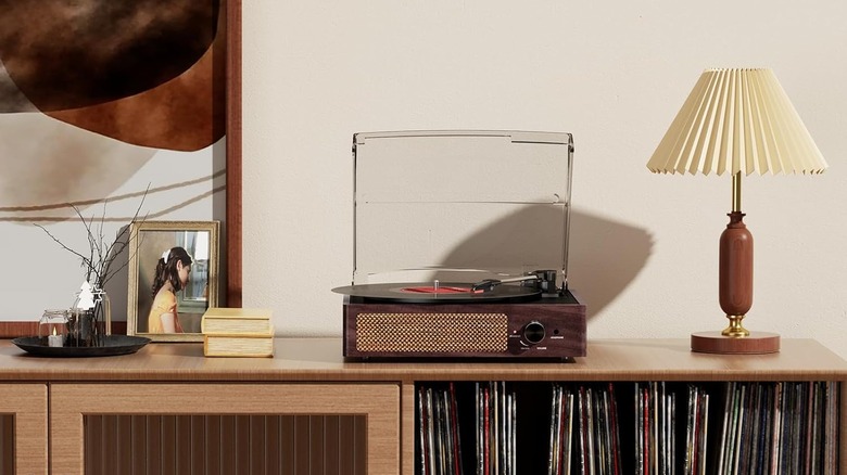 A COTSOCO turntable placed on top of a media cabinet.