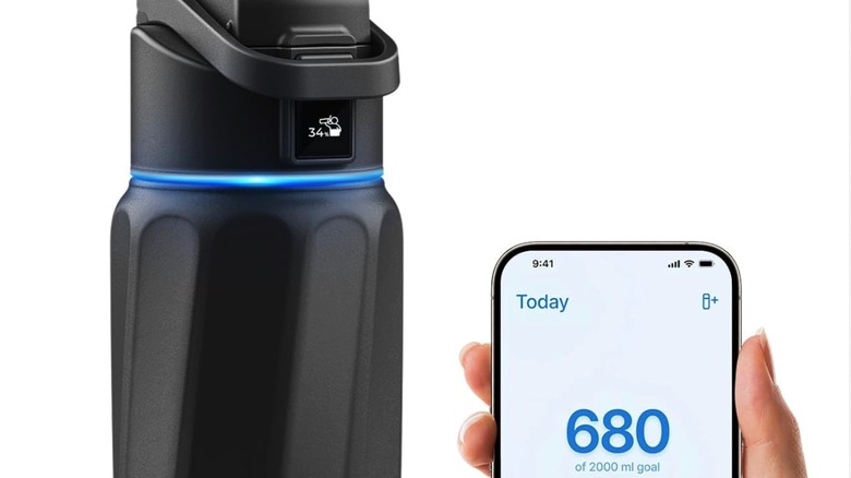 The top side of the Boost Smart Water Bottle and the WaterH app loaded on an iPhone.