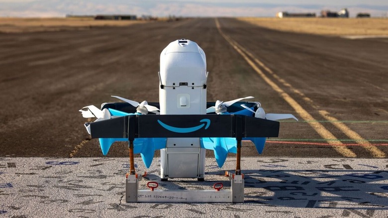 Amazon delivery drone sits on a road, waiting to take-off.