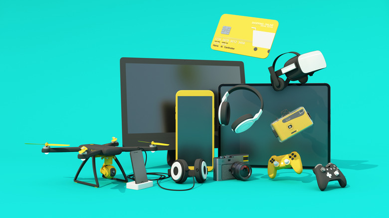 Several consumer electronics products against an aqua backdrop