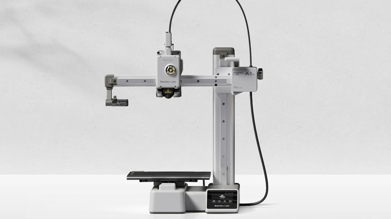 Bambu Lab A1 Mini 3D printer by itself with a blank background and nothing in progress