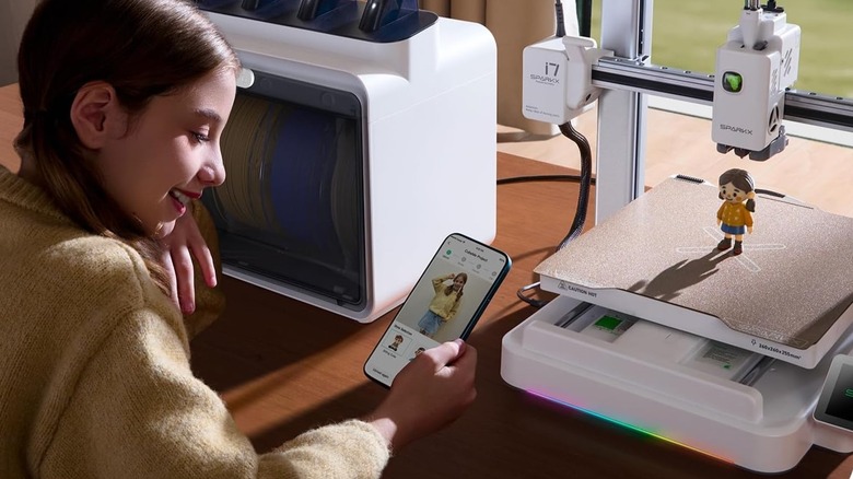 Creality SparkX i7 3D printer with little girl working on project from mobile