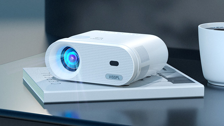 VISSPL mini-projector laying on a table