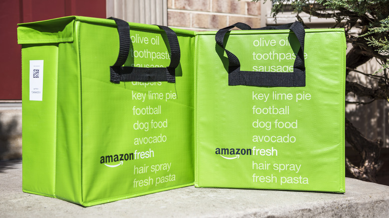 Amazon grocery delivery bags on a porch