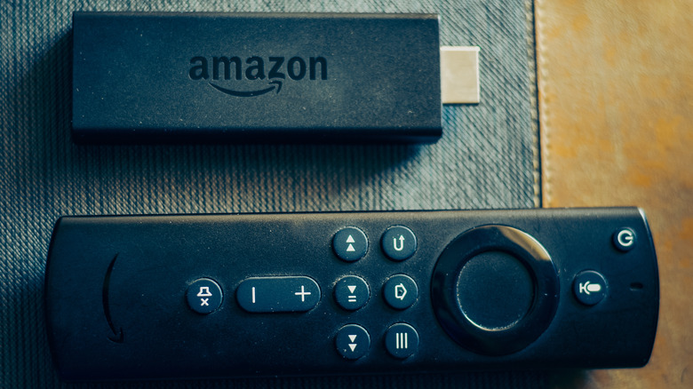 An Amazon Fire TV Stick with a remote.