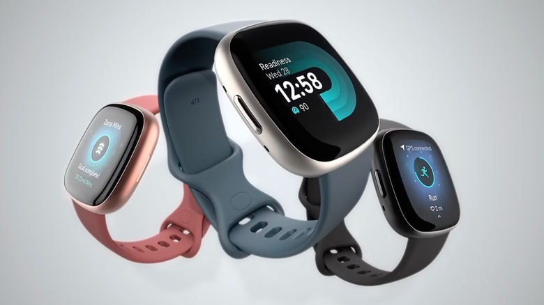 A screengrab from a promotional video on YouTube for the Fitbit Versa 4 smartwatch, this screengrab shows three different watches displaying three different screens