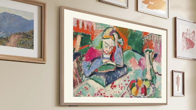 Hisense 55 CanvasTV frame-like TV mounted to the wall with other artwork