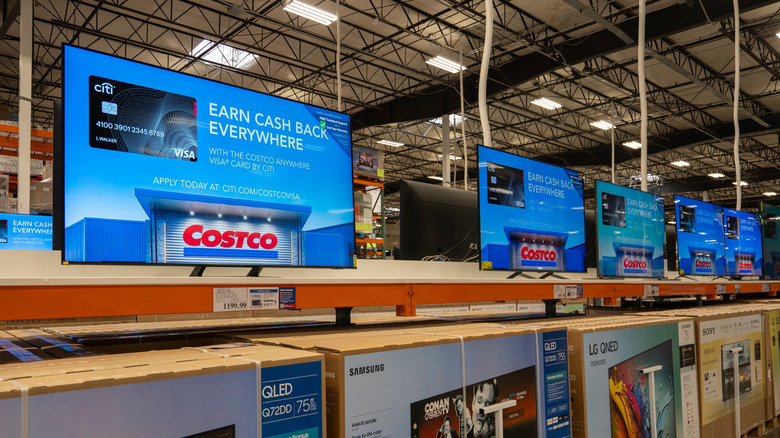TVs on display in a Costco electronics department