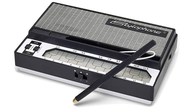 An Amazon promotional image for the Stylophone Electronic Synthesizer, showcasing the device's stylus capabilities