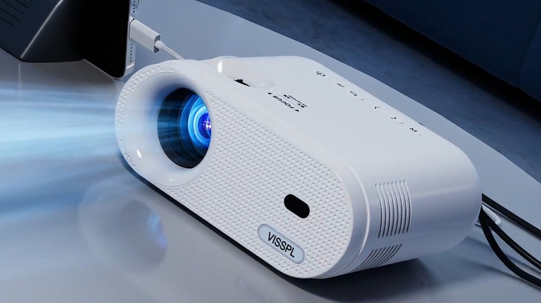 VISSPL Mini Projector on table connected to phone