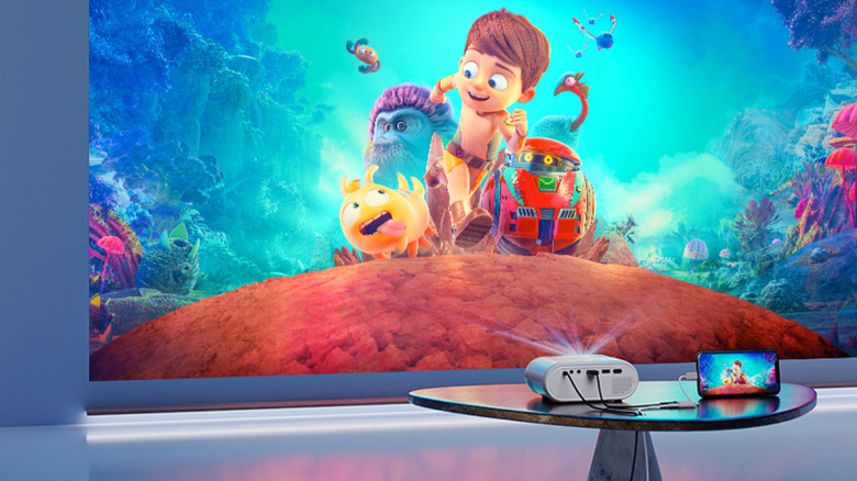 VISSPL Mini Projector projecting cartoons on wall