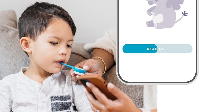 Child using a Kinsa Smart thermometer