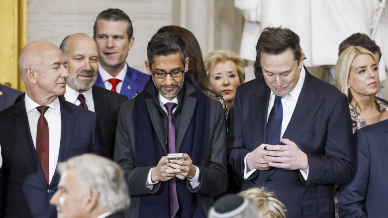 Amazon Chair Jeff Bezos, Alphabet CEO Sundar Pichai, and SpaceX CEO Elon Musk stand before a host of Trump administration officials at the President's inauguration.