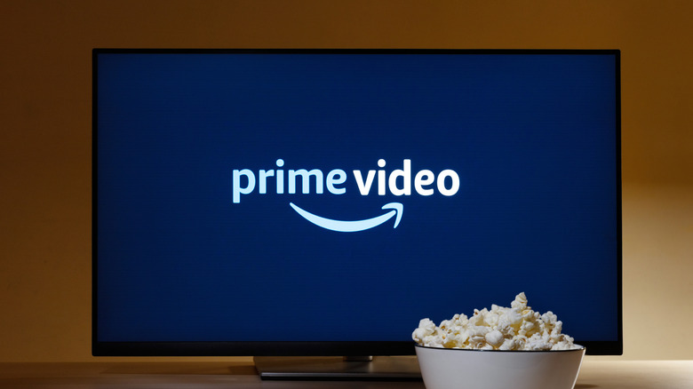 prime video logo showing on smart TV screen with bowl of popcorn in front of it