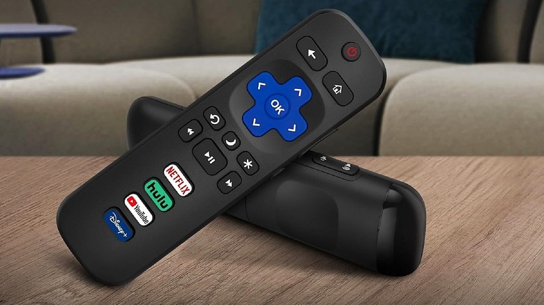 Roku TV replacement remotes from Acoyer on table.