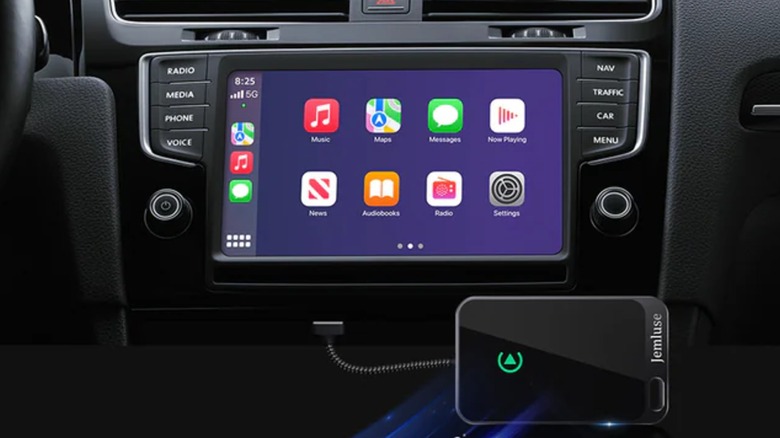 A promotional photo of the Jemluse Wireless CarPlay Adapter seeing use within a vehicle's infotainment system