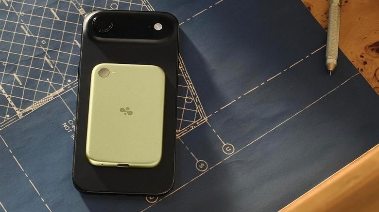 The Bee Eclipse device snapped on the back of an iPhone Air
