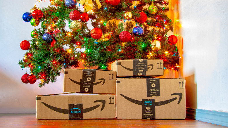 Amazon gift boxes under a Christmas tree.