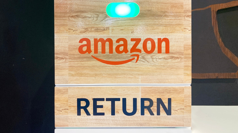 Amazon kiosk with return sign on the side.