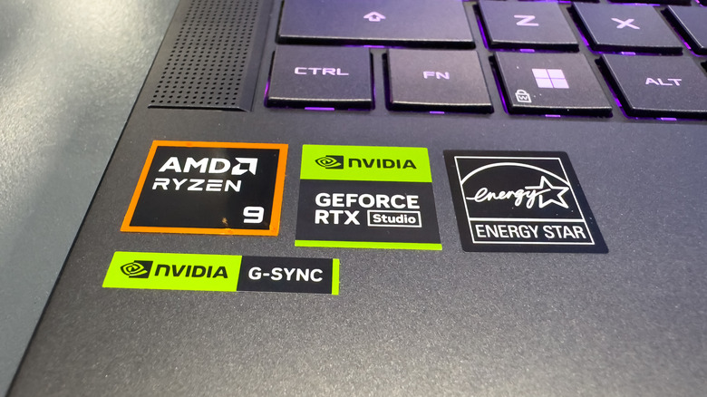 A laptop with stickers listing its internal components