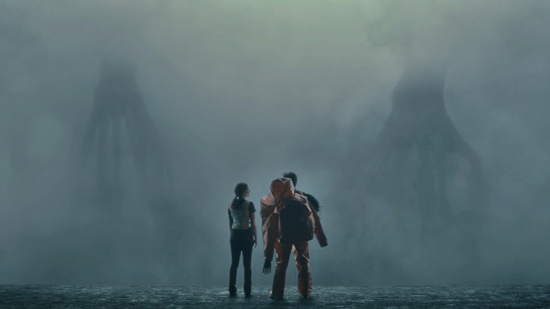 Louise and Ian standing in front of the two aliens, looking at each other