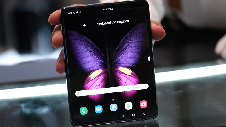 A stand host displays the new Samsung Galaxy Fold smartphone at the 2019 IFA