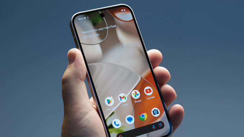 Close-up of a person holding the Google Pixel 9 smartphone