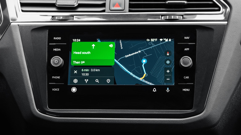 A closeup of a vehicle's dashboard showing Google Maps