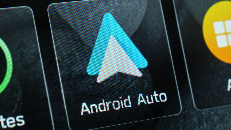 A closeup of the Android Auto icon on a vehicle's infotainment screen
