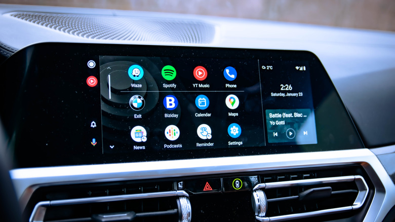 A vehicle's infotainment system displaying Android Auto, which is displaying a variety of apps