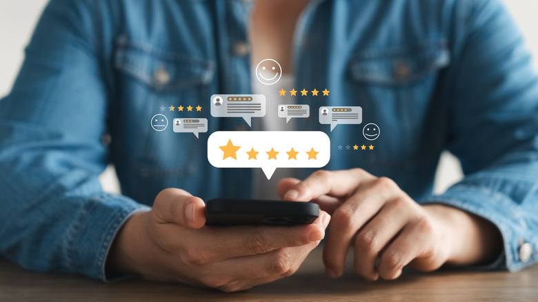 Person reviewing product with floating infographic stars